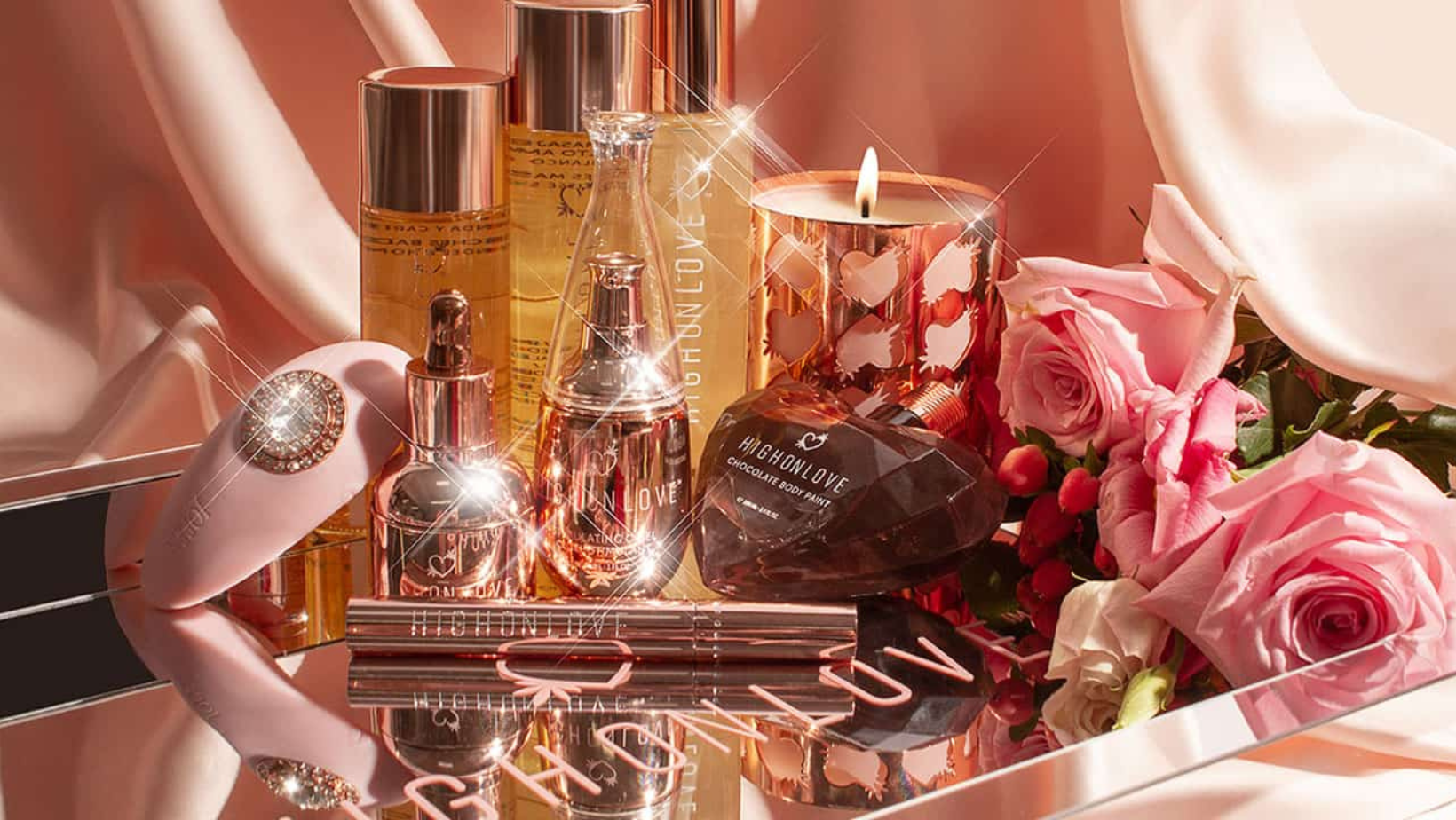 A display of High On Love cosmetics displayed alongside flowers with a satin backdrop